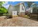 Charming home exterior with a fenced backyard and well-maintained gravel area at 1774 Timmons Marie Ln, Lincolnton, NC 28092