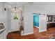 Bright foyer with hardwood floors, a barn door, and easy access to the kitchen at 1774 Timmons Marie Ln, Lincolnton, NC 28092