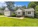 Charming home with well-manicured lawn, attached garage, and inviting front entrance at 1774 Timmons Marie Ln, Lincolnton, NC 28092