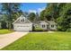 Beautiful home featuring an attached garage, well-kept lawn, and welcoming curb appeal at 1774 Timmons Marie Ln, Lincolnton, NC 28092