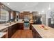 Modern kitchen featuring dark cabinetry, stainless steel appliances, and a granite island at 1774 Timmons Marie Ln, Lincolnton, NC 28092