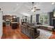 Open concept living room boasts hardwood floors, a vaulted ceiling, and a sectional sofa at 1774 Timmons Marie Ln, Lincolnton, NC 28092