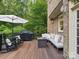 Inviting back deck with outdoor seating and grill, ideal for entertaining at 2103 Lytton Ln, Matthews, NC 28104