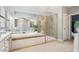 Elegant bathroom featuring a soaking tub, a luxurious shower, and ample space at 2103 Lytton Ln, Matthews, NC 28104