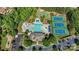 Aerial view of community amenities including pool, clubhouse, tennis courts, basketball court, and parking lot at 2103 Lytton Ln, Matthews, NC 28104