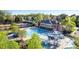 Community pool and clubhouse featuring slides, a large pool, a baby pool, lounge chairs, and tennis courts at 2103 Lytton Ln, Matthews, NC 28104