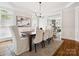 Dining room showcases hardwood floors, modern lighting, neutral colors, and adjacent living space at 2103 Lytton Ln, Matthews, NC 28104