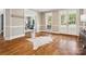 Bright foyer featuring hardwood floors, a decorative rug, and ample natural light at 2103 Lytton Ln, Matthews, NC 28104