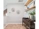 Inviting hallway with decorative shelving and stylish accents at 2103 Lytton Ln, Matthews, NC 28104