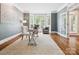 Sunlit office featuring hardwood floors, an area rug, a bay window and ample natural light at 2103 Lytton Ln, Matthews, NC 28104