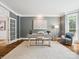 Bright home office with hardwood floors, a cozy chair, and large bay window at 2103 Lytton Ln, Matthews, NC 28104