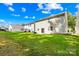 Expansive backyard featuring lush green grass, bordered by neighboring homes and mature trees at 2316 Savannah Hills Dr, Matthews, NC 28105