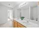 Large bathroom with double vanity, modern lighting, and a large mirror at 2316 Savannah Hills Dr, Matthews, NC 28105