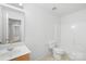 Clean bathroom featuring tile floors, single vanity, and shower-tub combo at 2316 Savannah Hills Dr, Matthews, NC 28105