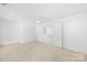 Bright, carpeted bedroom with open door and white ceiling fan at 2316 Savannah Hills Dr, Matthews, NC 28105