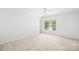 Bright bedroom with carpet and white walls, providing a serene atmosphere at 2316 Savannah Hills Dr, Matthews, NC 28105