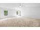 Bright, airy bedroom featuring carpet, neutral walls, and double windows, offering ample natural light at 2316 Savannah Hills Dr, Matthews, NC 28105