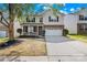 Charming two-story home with brick and siding, a well-manicured lawn, and attached two-car garage at 2316 Savannah Hills Dr, Matthews, NC 28105