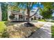 Charming two-story home with brick and vinyl siding, a manicured lawn and inviting front porch at 2316 Savannah Hills Dr, Matthews, NC 28105