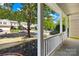 Inviting front porch with white railings, landscaping, and view of the neighborhood street at 2316 Savannah Hills Dr, Matthews, NC 28105
