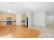 Open kitchen featuring stainless appliances, wood cabinets, and hardwood floors at 2316 Savannah Hills Dr, Matthews, NC 28105