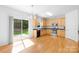 Modern kitchen with stainless steel appliances, and wood cabinetry, with access to the backyard at 2316 Savannah Hills Dr, Matthews, NC 28105