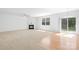Inviting living room featuring a cozy fireplace, ceiling fan, and sliding glass doors to the backyard at 2316 Savannah Hills Dr, Matthews, NC 28105