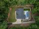 Overhead view of a private home and a backyard oasis with a pristine pool and lush landscaping at 2418 Shuford Rd, Lincolnton, NC 28092