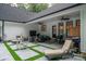 Outdoor patio with stylish furniture, grill, and landscaped yard for perfect relaxation and entertainment at 2418 Shuford Rd, Lincolnton, NC 28092