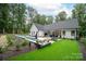 Beautiful backyard featuring a luxurious pool, manicured lawn, and outdoor dining area at 2418 Shuford Rd, Lincolnton, NC 28092