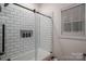 Stylish bathroom with a white subway tile tub and shower combination with glass screen at 2418 Shuford Rd, Lincolnton, NC 28092