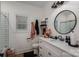 Modern bathroom featuring stylish fixtures, a black framed mirror, and elegant decor at 2418 Shuford Rd, Lincolnton, NC 28092