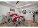 Stylish bedroom features a statement headboard, ample lighting, and a cozy aesthetic at 2418 Shuford Rd, Lincolnton, NC 28092