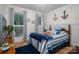 Nautical themed bedroom with coastal decor, blue accents, and bright windows at 2418 Shuford Rd, Lincolnton, NC 28092