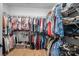 Large walk-in closet featuring ample storage space and organized shelving for clothes and shoes at 2418 Shuford Rd, Lincolnton, NC 28092
