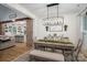 Dining room featuring wooden table, bench seating and exposed brick column at 2418 Shuford Rd, Lincolnton, NC 28092