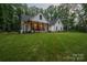 Charming farmhouse with a large front lawn and inviting front porch at 2418 Shuford Rd, Lincolnton, NC 28092
