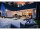 Outdoor living space featuring a covered patio with ceiling fans, outdoor kitchen, and comfortable seating, perfect for relaxing at 2418 Shuford Rd, Lincolnton, NC 28092