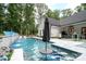 Beautiful backyard pool with built in table and umbrella, set in landscaped backyard at 2418 Shuford Rd, Lincolnton, NC 28092