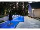 Backyard pool featuring illuminated fountains, in-pool seating, and a patio area perfect for relaxing and entertaining guests at 2418 Shuford Rd, Lincolnton, NC 28092