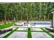 Backyard with a seating area beside the pool, offering a relaxing and stylish outdoor space at 2418 Shuford Rd, Lincolnton, NC 28092