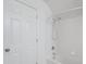 White bathroom featuring a bathtub and shower with brushed silver fixtures at 2656 Polo Club Blvd, Matthews, NC 28105