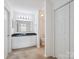Bright bathroom features a granite countertop, neutral tile flooring, and white cabinets at 2656 Polo Club Blvd, Matthews, NC 28105
