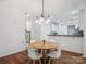Open concept dining room with modern light fixture at 2656 Polo Club Blvd, Matthews, NC 28105