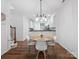 Open concept dining room with modern light fixture at 2656 Polo Club Blvd, Matthews, NC 28105