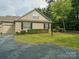 Charming home featuring a spacious driveway and meticulously maintained landscaping at 2656 Polo Club Blvd, Matthews, NC 28105
