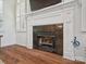 Close up of fireplace with white trim and black tile surround at 2656 Polo Club Blvd, Matthews, NC 28105
