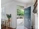 Bright entryway featuring hardwood floors, a modern door, and natural light at 2656 Polo Club Blvd, Matthews, NC 28105