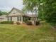 Charming single-Gathering home featuring a well-manicured lawn and lush landscaping at 2656 Polo Club Blvd, Matthews, NC 28105