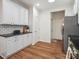 Bright kitchen featuring white cabinets, granite countertops, stainless steel appliances and a subway tile backsplash at 2656 Polo Club Blvd, Matthews, NC 28105